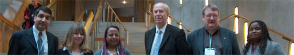 Malcolm with members of the Opening Doors scheme in the garden lobby of the Scottish Parliament buildings